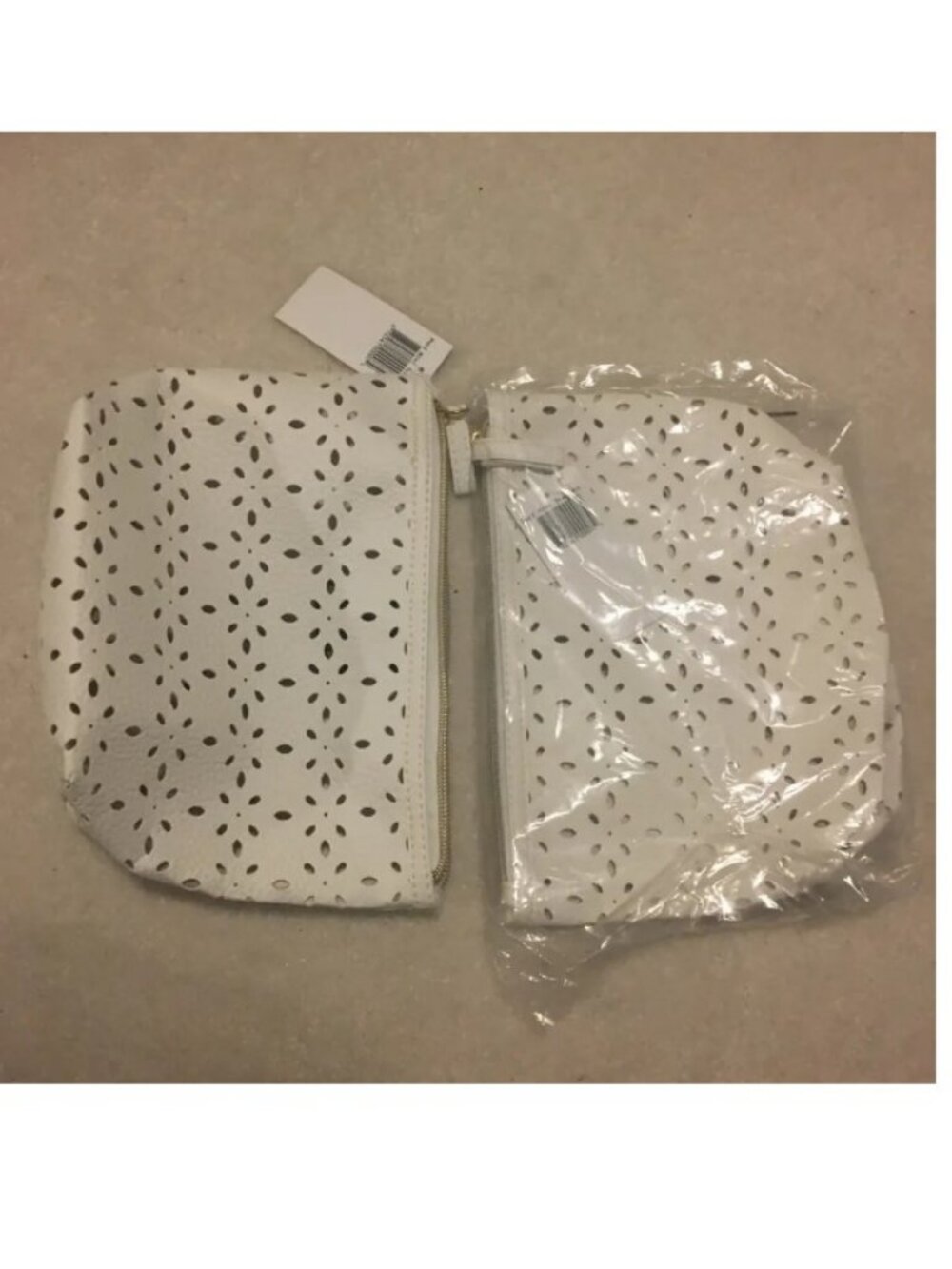 2 sets of Saks Fifth Avenue White Perforated makeup bags